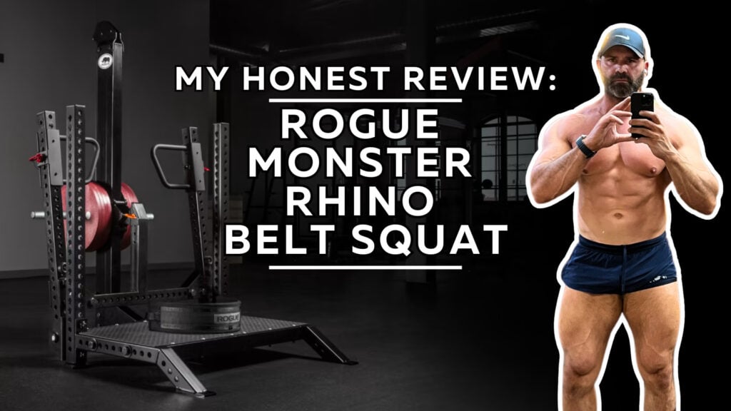 A bodybuilder in a cap and shorts takes a selfie beside a Rogue Monster Rhino Belt Squat machine in a gym, with review text about his workout displayed in the center.